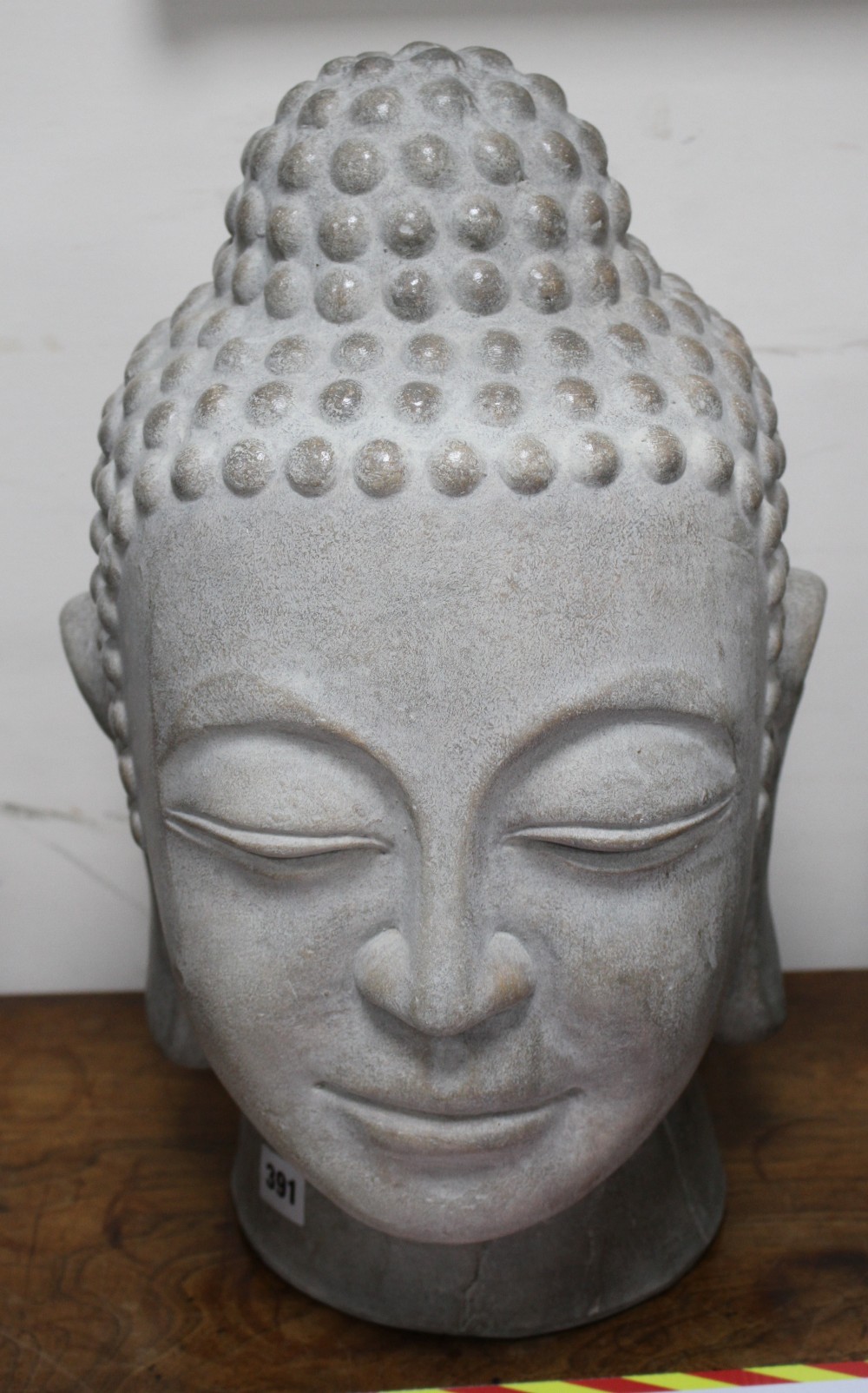 A Far Eastern ceramic Buddha head, height 44cm